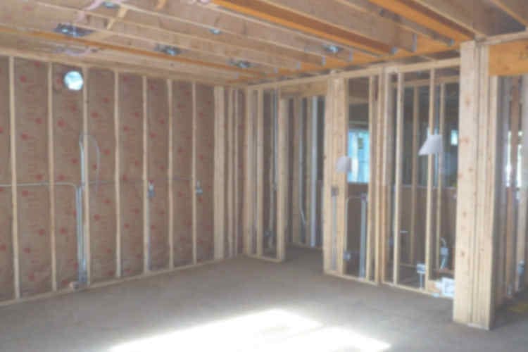 New construction banner image with view of framed house under construction - Platinum Builders