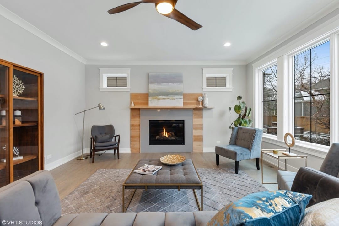 Large open living room with fireplace and custom mantle | Platinum Builders